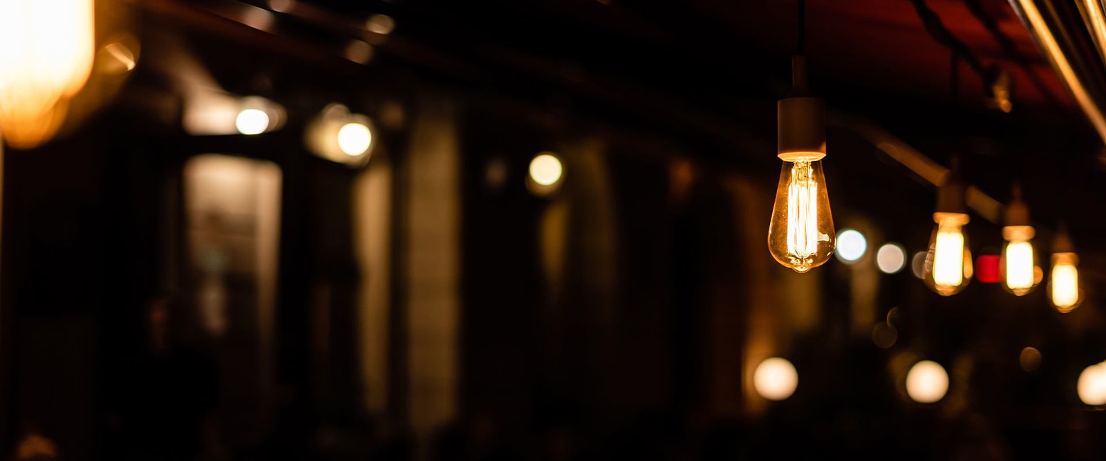 Warm ambient light inside traditional British pub interior
